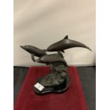 A SPELTER ORNAMENT IN THE FORM OF THREE DOLPHINS