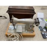 A VINTAGE BROTHER SEWING MACHINE AND A FURTHER SEWING MACHINE IN A WOODEN CASE (NO KEY)