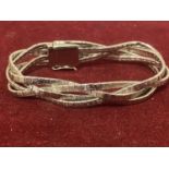 A SILVER TWISTED STYLE BRACELET