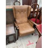 A MAHOGANY AND LEATHER WING BACK ARMCHAIR