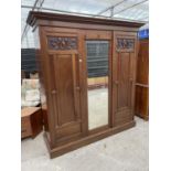 A LATE VICTORIAN MAHOGANY MIRROR DOOR WARDROBE WITH HANGING COMPARTMENT,DRAWERS ANS SLIDES 79 INCHES