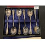 A BOXED SET OF WALKER AND HALL SILVER PLATED SOUP SPOONS