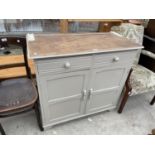 AN OAK SHABBY CHIC DRESSER BASE WITH TWO DOORS AND TWO DRAWERS