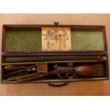 A CASED SOUTH AFRICAN DOUBLE BARRELLED PERCUSSION CAP COMBINATION SHOTGUN/RIFLE GUN 70CM BARRELS,