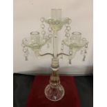 A VINTAGE GLASS THREE BRANCH CANDLESTICK WITH DROP GLASS DETAIL