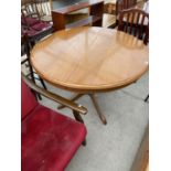 A CIRCULAR ERCOL STYLE EXTENDING DINING TABLE, 43" DIAMETER