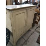 A VINTAGE PAINTED WOODEN CABINET WITH INTERNAL SHELVES AND TWO DOORS