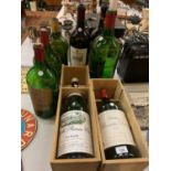 AN ASSORTMENT OF LARGE VINTAGE WINE BOTTLES, SOME TO INCLUDE BATTERY POWERED LIGHTS