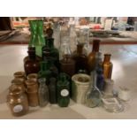 A LARGE ASSORTMENT OF CERAMIC AND GLASS MEDICINE BOTTLES