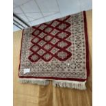 AN ANTIQUE HAND MADE TURKISH WOOL RUG