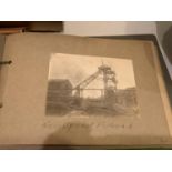 A BOOK OF VARIOUS BLACK AND WHITE PRINTS OF WORKMEN AND INDUSTRIAL SCENES TOGETHER WITH A '