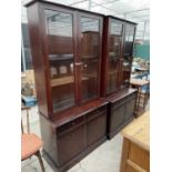 TWO STAG MINSTREL GLAZED TWO DOOR BOOKCASES WITH CUPBOARDS AND DRAWERS TO THE BASE