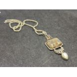 A SILVER NECKLACE WITH SMOKED STONE PENDANT BOTH MARKED 925