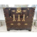 A 19TH CENTURY KOREAN TANSU CHEST CABINET "MANJA SWASTIKA" WITH LUCK SYMBOLS AND A LARGE FISH