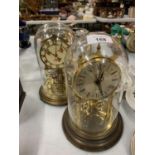 TWO DOMED GLASS MANTEL CLOCKS