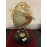 A GLOBE ON A WOODEN STAND TO INCLUDE A COMPASS WITHIN THE BASE HEIGHT 31CM