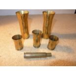 A PAIR OF WORLD WAR II TRENCH ART 2 POUNDER SHELL CASES DATED 1940, HEIGHT 13CM, THREE SMALLER SHELL