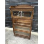 A LEBUS OAK FOUR TIER BOOKCASE WITH UP AND OVER GLAZED DOORS - 35" WIDE