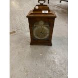 A WALNUT CASED 'ELLIOTT, LONDON' CHIMING MANTEL CLOCK