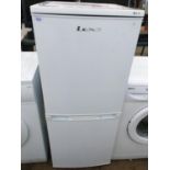 A WHITE LEC SHORT UPRIGHT FRIDGE FREEZER BELIEVED IN WORKING ORDER BUT NO WARRANTY