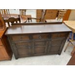 A JAYCEE OAK SIDEBOARD WITH THREE DOORS AND THREE DRAWERS - 54" WIDE