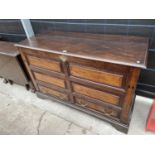 A GEORGE III OAK COFFER WITH TWO DRAWERS TO BASE - 57" WIDE