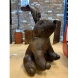 A FAUX LEATHER RABBIT DOORSTOP