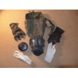 A GAS MASK, PAIR OF RUBBER GLOVES, COTTON GLOVES ETC