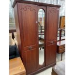 A MODERN MAHOGANY EFFECT TWO DOOR WARDROBE WITH CENTRAL MIRROR, 47" WIDE