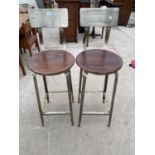 A PAIR OF "ANDY THORNTON ORIGINAL" INDUSTRIAL STYLE METALWARE TALL STOOLS WITH CIRCULAR SEATS