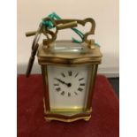 A FRENCH BRASS FRAMED CARRIAGE CLOCK - WORKING WHEN CATALOGUED (DOOR A/F)