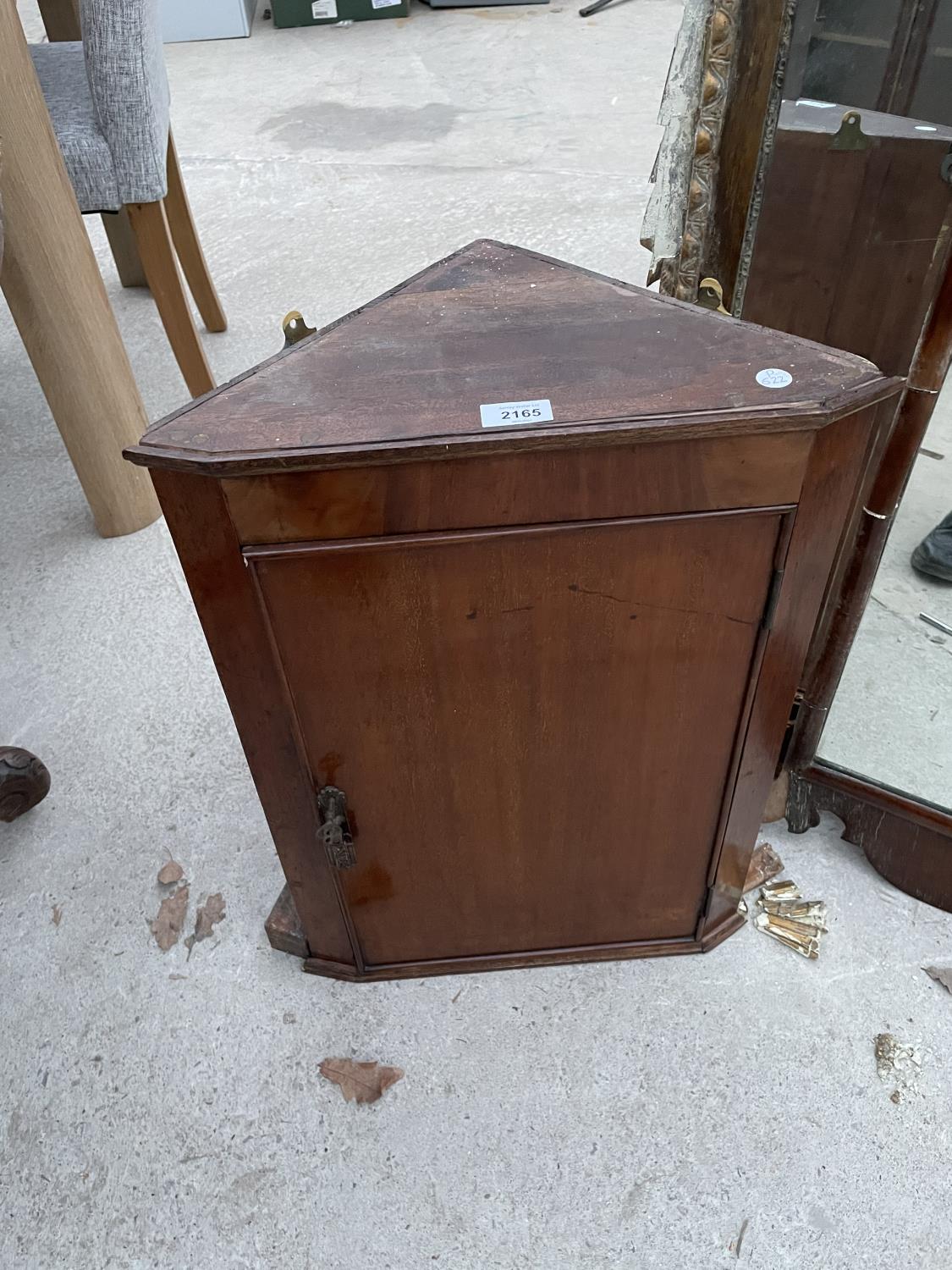 A SMALL MAHOGANY CORNER CUPBOARD