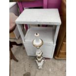 A LLOYD LOOM STYLE OTTOMAN/LOCKER AND A PAINTED LAMP BASE