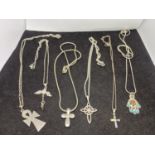 SIX SILVER NECKLACES WITH VARIOUS PENDANTS TO INCLUDE CROSSES