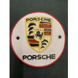 A METAL PORSCHE BADGE PLAQUE