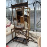 A VICTORIAN BAMBOO AND MIRRORED HALL STAND WITH SEVEN HOOKS, GLOVE BOX AND EMBOSSED BRASS FITTINGS -