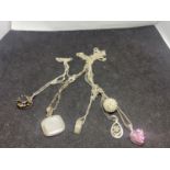 SIX SILVER NECKLACES WITH PENDANTS