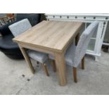 A MODERN SQUARE OAK DINING TABLE AND TWO DINING CHAIRS