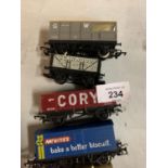 SEVEN OO GAUGE FREIGHT CARRIAGES TO INCLUDE A MCVITIES TRAILER AND A SCARWOOD COAL TRAILER ETC