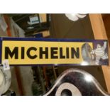 A METAL MICHELIN MAN CAVE SIGN