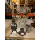 A PAIR OF GLASS BARLEY TWIST STYLE OL LAMPS, A DECORATIVE PEWTER OIL LAMP AND TANKARD ETC