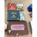 AN ASSORTMENT OF BOARD GAMES AND COOK BOOKS