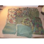 A QUANTITY OF CAMOFLAGE UNIFORMS, TWO SHIRTS, TWO PAIRS OF TROUSERS ETC