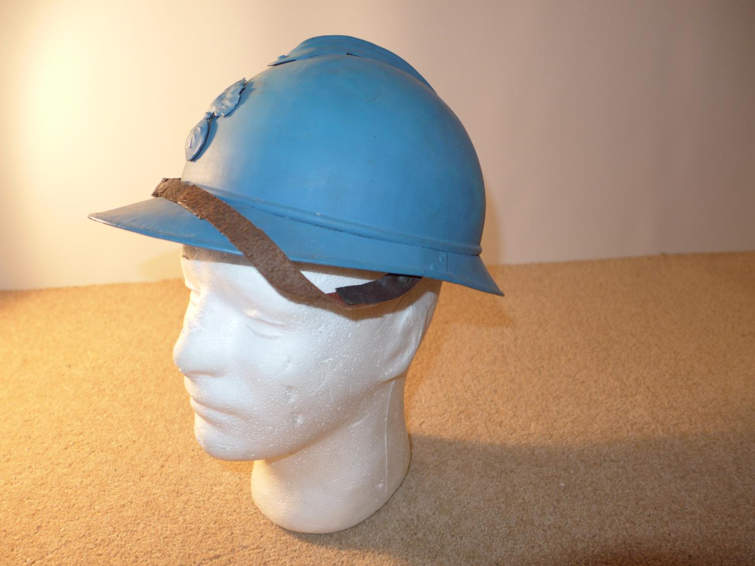 A BLUE PAINTED FRENCH ARMY ADRIAN HELMET WITH LEATHER LINING