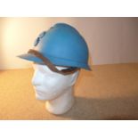 A BLUE PAINTED FRENCH ARMY ADRIAN HELMET WITH LEATHER LINING