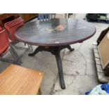 A LARGE PINE TRIPOD TABLE 52 INCHES DIAMETER WITH ONE CHAIR