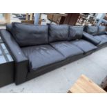 A LARGE LEATHER THREE SEATER SOFA