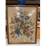 A FRAMED NEEDLEWORK OF FLOWERS 49CM X 37CM