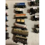 SEVEN OO GAUGE FREIGHT CARRIAGES TO INCLUDE A GULF FUEL TANKER AND A MCVITIES CONTAINER ETC