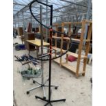 A BLACK METAL CLOTHES STAND AND A FURTHER CHROME CLOTHES STAND